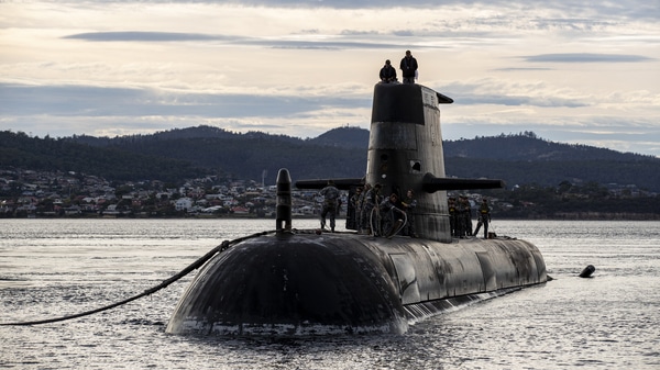 A Royal Australian Navy submarine arrives at a logistics port visit on April 1, 2021 in Hobart, Australia. New nuclear-powered submarines will eventually replace them.